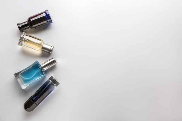 Bottles of perfume on light background - Foto, Imagem