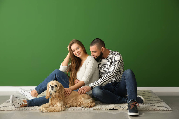 Young couple and their dog in new empty flat - Photo, Image