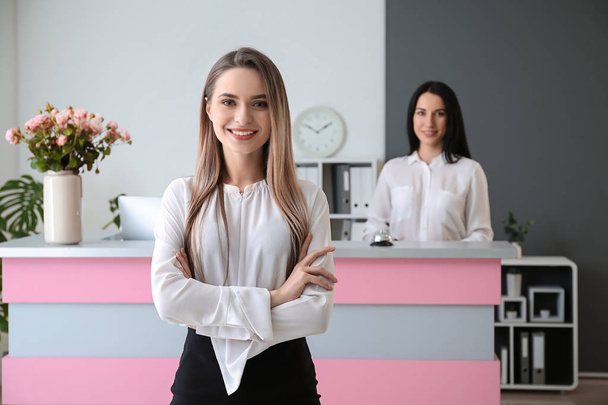 Young female receptionist in hotel - Photo, Image