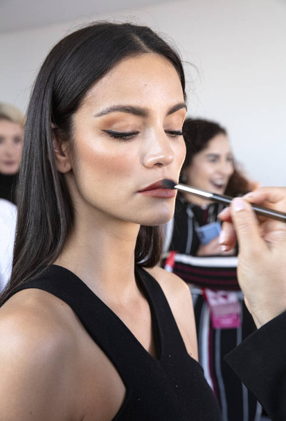 New York, NY - February 08, 2019: A model prepares backstage for the Cushnie Fall Winter 2019 fashion show during New York Fashion Week - Photo, Image