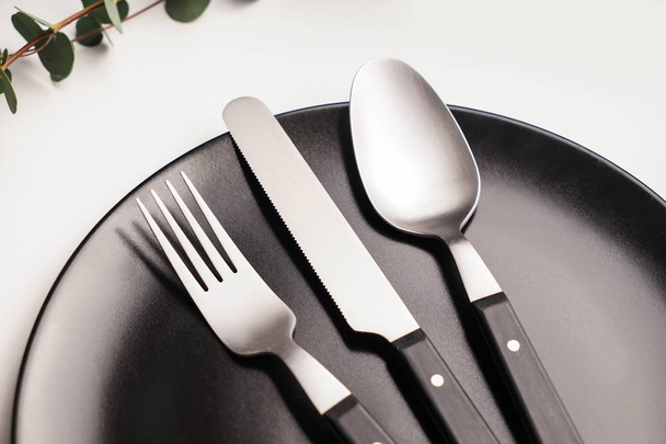Silver cutlery with plate on table - Photo, image