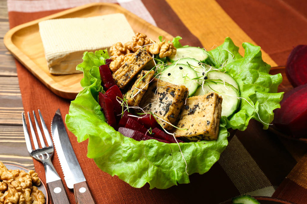 Healthy salad with tasty tofu cheese in bowl on table - Photo, Image