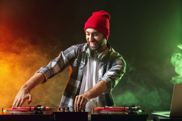 Male DJ playing music in club - Photo, Image