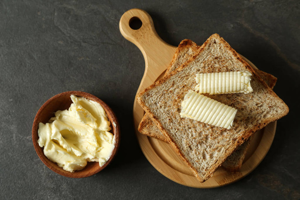 Composition with tasty toasts and butter on table - Photo, Image