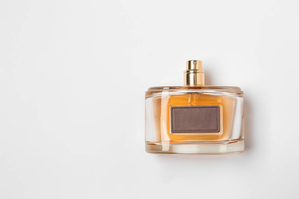 Bottle of perfume on white background - Foto, Imagen