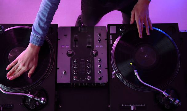 Female DJ playing music in club, top view - Fotoğraf, Görsel