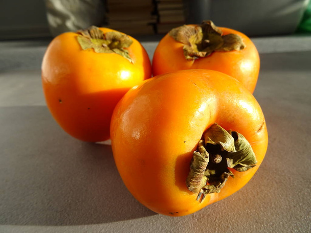 Organic tasty orange Persimmons - Foto, Imagen