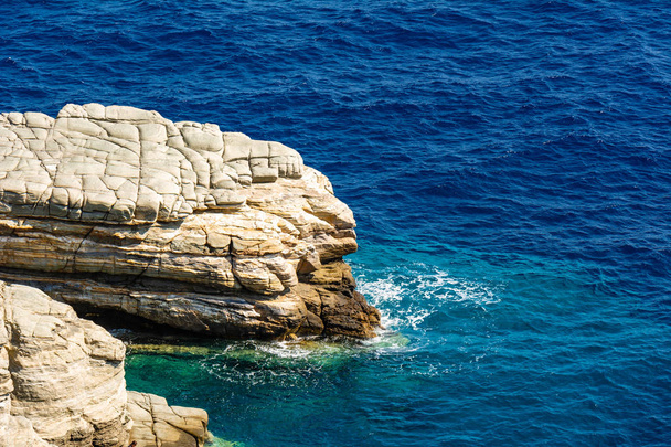 A rock surrounded by sea water. Aegean Sea, Cyclades. Greece - Photo, Image
