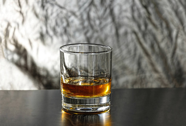 Strong alcoholic drink close-up on the bar. Cognac, bitter, whiskey - Fotó, kép