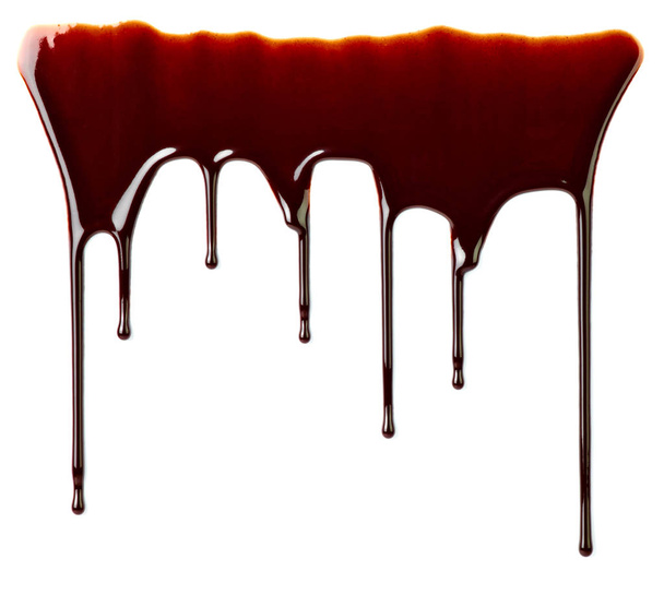 Крупним планом шоколадний сироп, що витікає на білому тлі
 - Фото, зображення