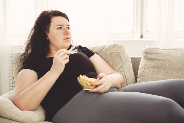 fat woman overeating junk food. sedentariness - Fotó, kép