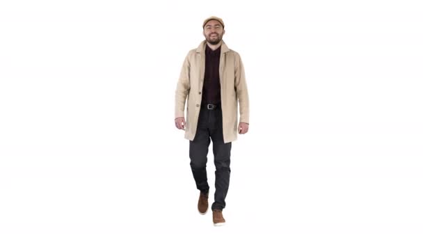 Handsome man in fashionable clothes walking and smiling on white background. - Footage, Video