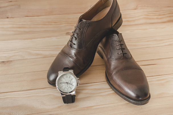 Shoes and watch as accessories to dress elegantly - Foto, Imagem