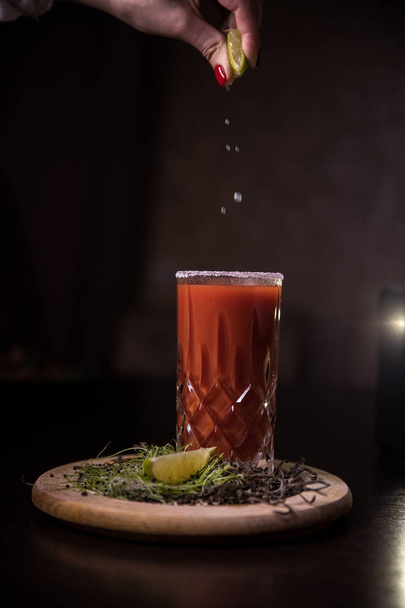 fresh juices from natural products on a black background.tomato juice - Photo, Image