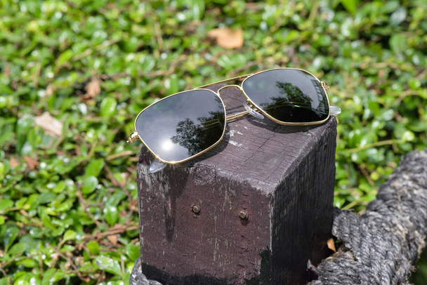 accessories, closeup sunglasses with gold frame.  - Photo, Image