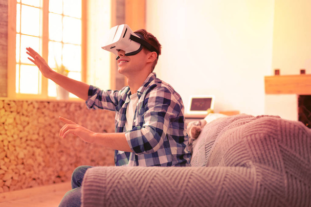 Vigorous attractive guy visualizing thoughts in VR - Foto, Imagem