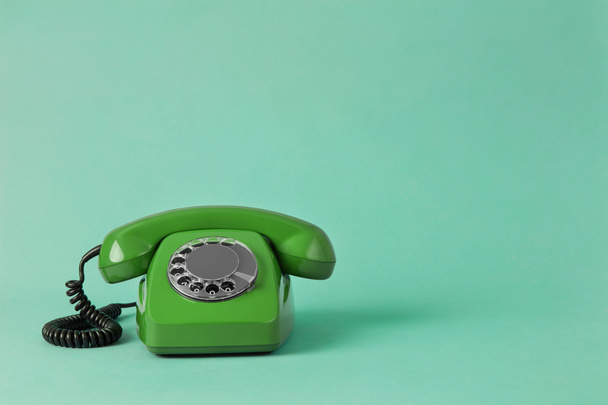Vintage telephone on colored background - Photo, Image