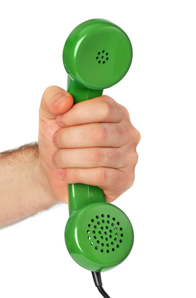 Mão segurando um receptor de telefone antigo
 - Foto, Imagem