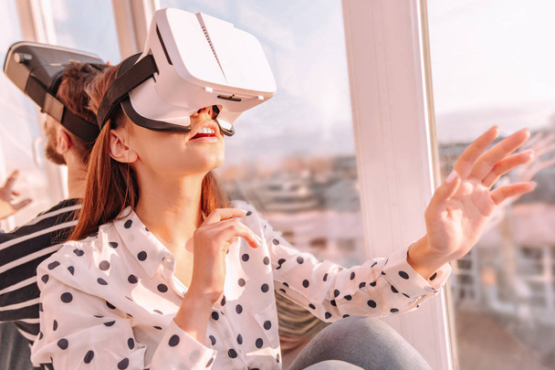 Pleasant man and woman wearing VR glasses - Photo, Image