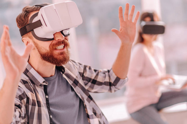 Bearded man resting walking in virtual reality - Фото, изображение