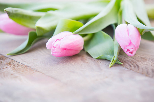 Pink tulips on rustic wooden table romantic background - Photo, Image