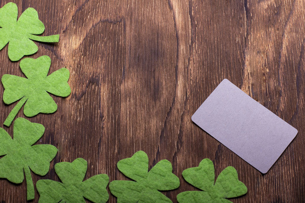 Green clover leaf on wooden background - Фото, зображення