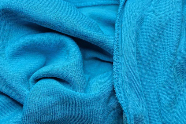Blue background of a fragment of crumpled material - Photo, Image