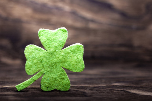 Green clover leaf on wooden background - Photo, Image