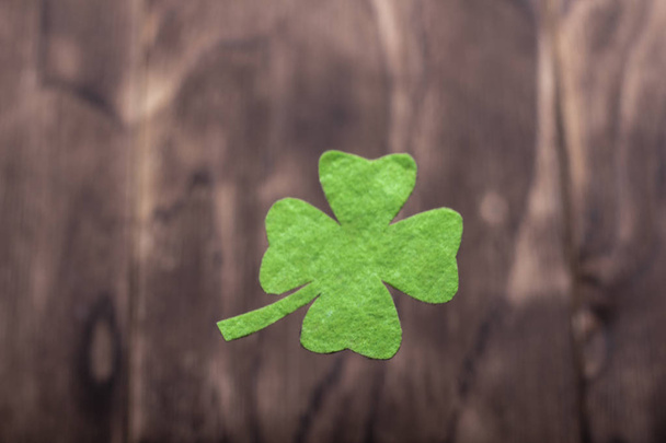Green clover leaf on wooden background - Photo, Image