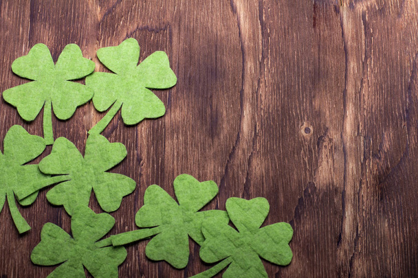 Green clover leaf on wooden background - Foto, immagini