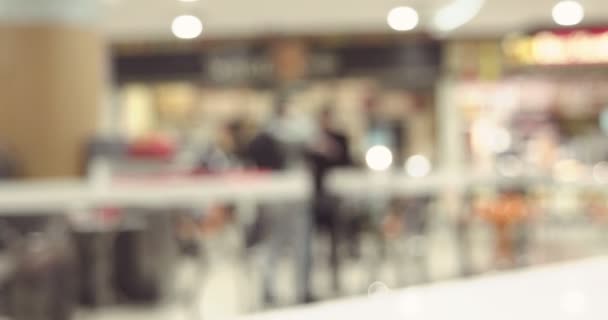 Blurred background of fast moving people in mall food-court - Footage, Video
