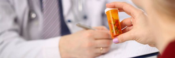 Female medicine doctor hand hold jar of pills and - Φωτογραφία, εικόνα