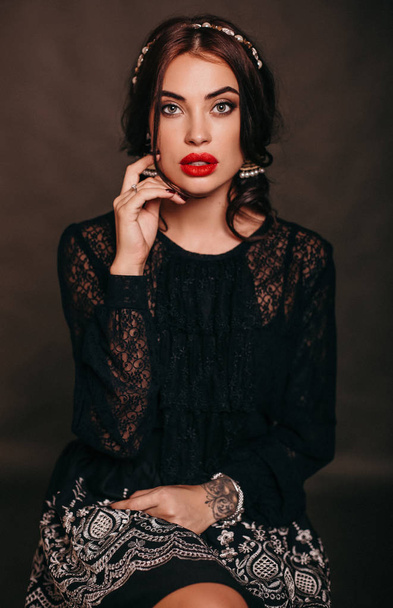 fashion studio photo of beautiful sexy woman with long dark hair in elegant clothes - Фото, зображення