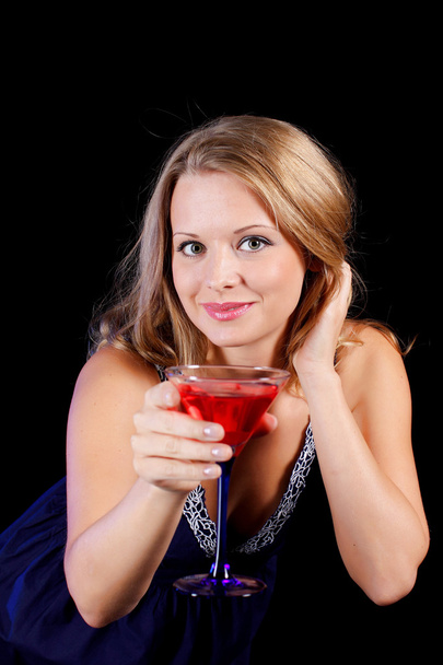 a charming young lady holding a glass of red wine - Photo, Image