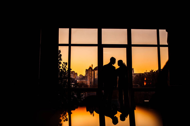 Beautiful young couple  posing at sunset - Photo, Image