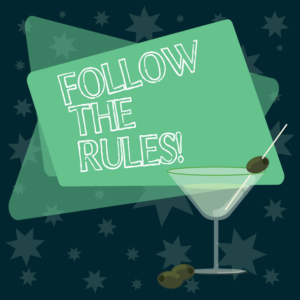 Writing note showing Follow The Rules. Business photo showcasing act in agreement or compliance with obey them Firmly Filled Cocktail Wine Glass with Olive on the Rim Text Space. - Photo, Image