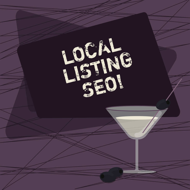 Conceptual hand writing showing Local Listing Seo. Business photo showcasing promotional strategy used improve visibility your business Filled Cocktail Wine Glass with Olive on the Rim Text Space. - Photo, Image
