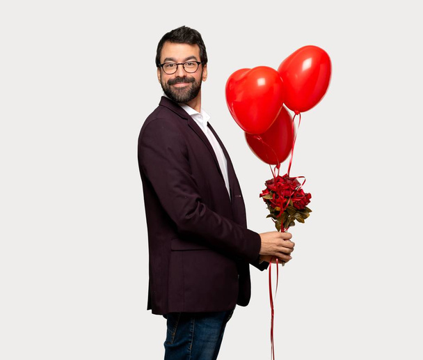 Man in valentine day With happy expression over isolated grey background - Foto, Imagen