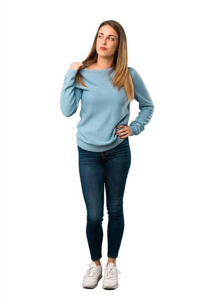 Full body of Blonde woman with blue shirt with tired and sick expression on white background - Photo, Image