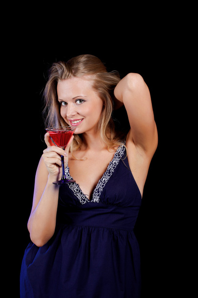 a charming young lady holding a glass of red wine - Фото, зображення