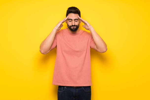 Handsome man over yellow wall unhappy and frustrated with something - Photo, Image