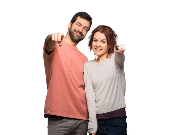 Couple in valentine day points finger at you with a confident expression on isolated white background - Foto, Imagen