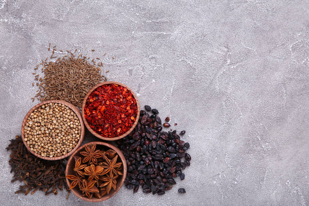 Spices mix on a grey background, macro. - Zdjęcie, obraz