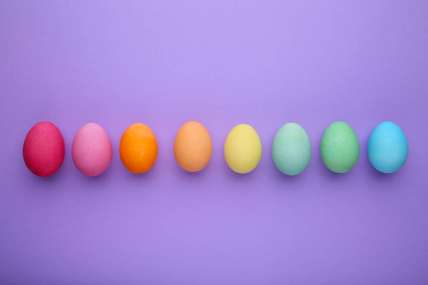 Colorful easter eggs on a purple background - Zdjęcie, obraz