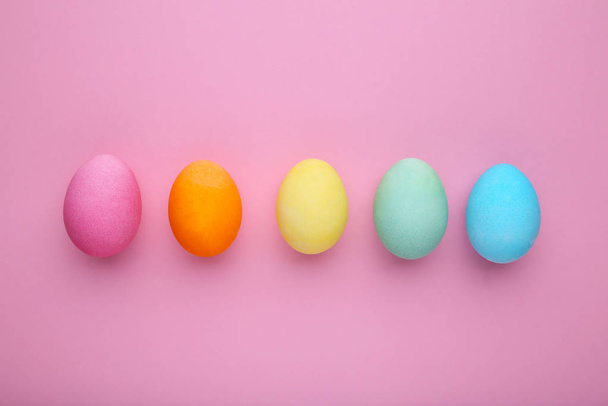 Colorful easter eggs on a pink background - Фото, зображення