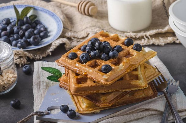 Crispy homemade waffles with berries, topped maple syrup - Fotografie, Obrázek