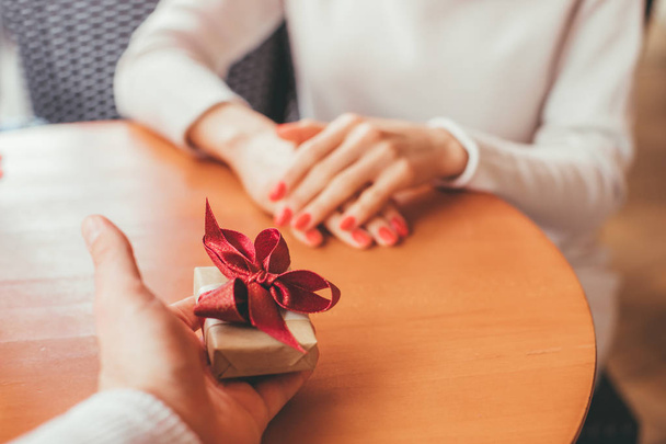 Man gives a present to his girlfriend - POV Image - follow me concept - 写真・画像
