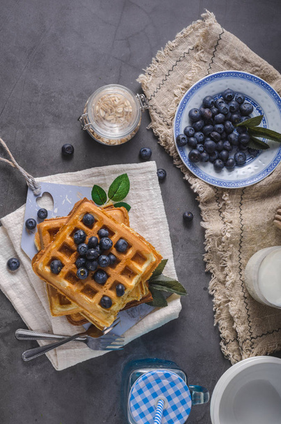 Crispy homemade waffles with berries, topped maple syrup - Φωτογραφία, εικόνα