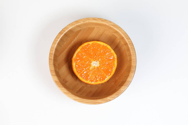 Half Sliced Orange mandarin Lemon in a bowl  - Photo, Image