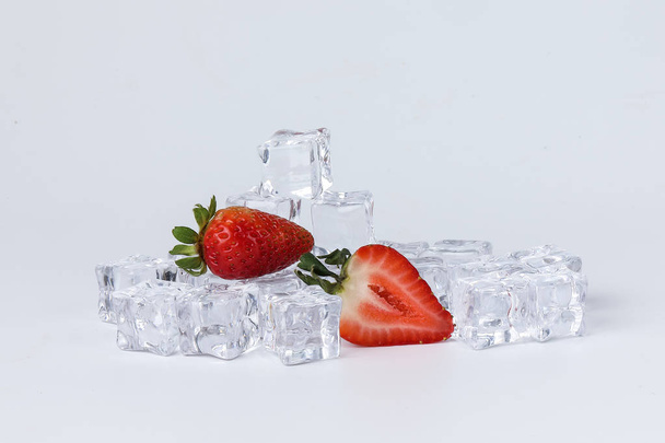 Strawberry read ice cube on white background - Φωτογραφία, εικόνα